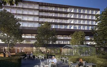 Modern Zürich Seebach office space rental at Thurgauerstrasse 101 with outdoor seating area and people engaged in casual business discussions.